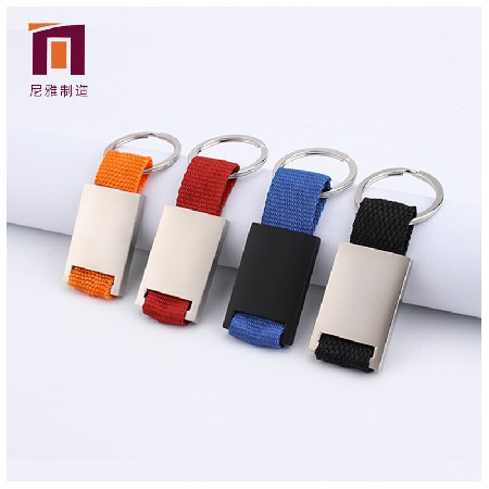 Manufacturer provides metal ribbon keychains, creative key pendants, various colors available, personalized processing logo